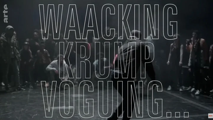 A rehearsal scene: a dancer in the center, surrounded by other dancers, as if in a competition. Superimposed over the scene are the stylized words: "Waacking," "Krump," and "Voguing."